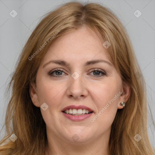 Joyful white adult female with long  brown hair and brown eyes