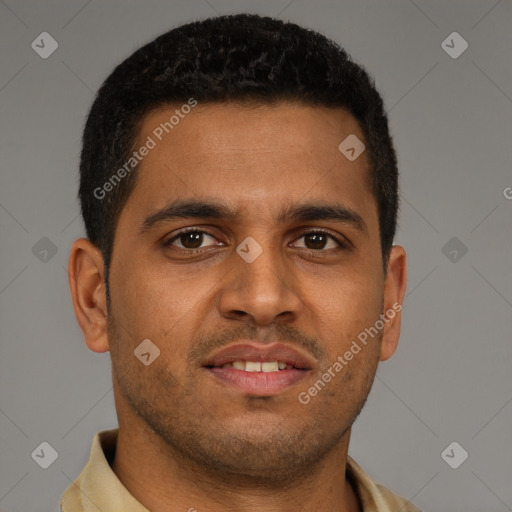 Joyful black young-adult male with short  brown hair and brown eyes