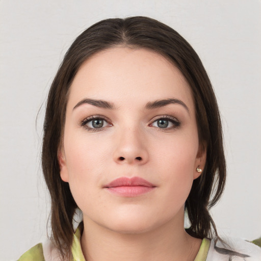 Neutral white young-adult female with medium  brown hair and brown eyes