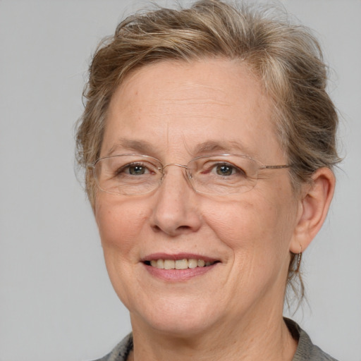 Joyful white middle-aged female with medium  brown hair and brown eyes