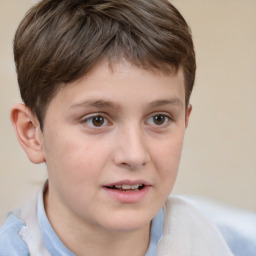 Joyful white child male with short  brown hair and brown eyes