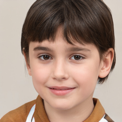 Joyful white child male with medium  brown hair and brown eyes