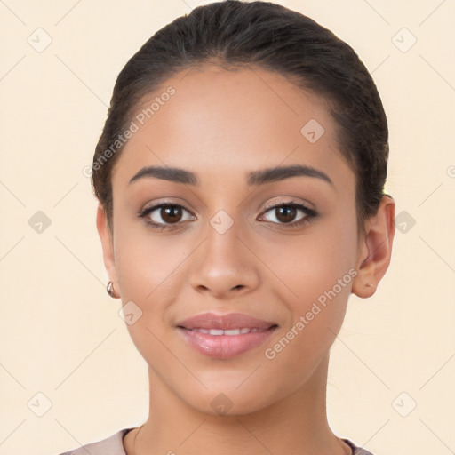 Joyful latino young-adult female with short  brown hair and brown eyes