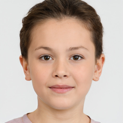 Joyful white child female with short  brown hair and brown eyes