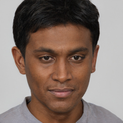 Neutral black young-adult male with short  brown hair and brown eyes