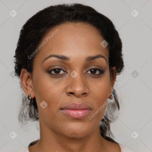 Joyful black young-adult female with medium  brown hair and brown eyes