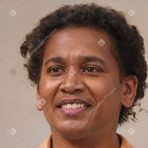 Joyful black adult female with short  brown hair and brown eyes