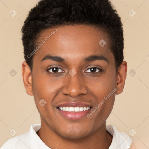 Joyful black young-adult male with short  brown hair and brown eyes