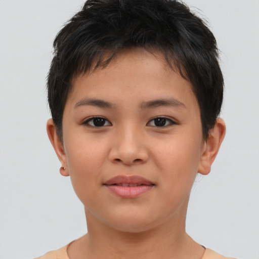 Joyful asian child female with short  brown hair and brown eyes