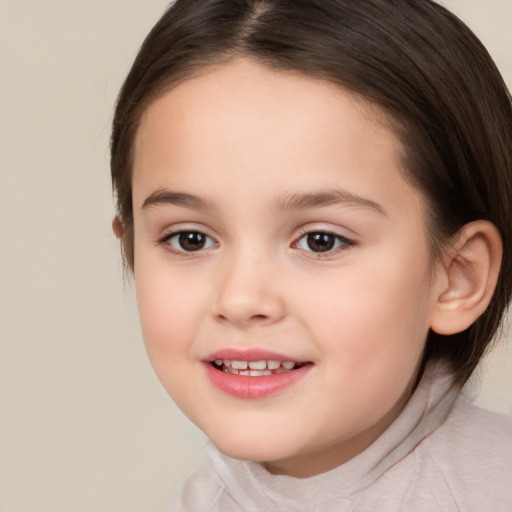 Joyful white child female with medium  brown hair and brown eyes