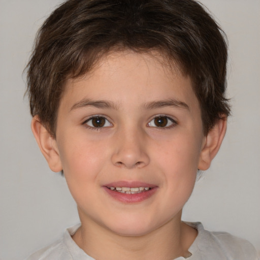 Joyful white child male with short  brown hair and brown eyes