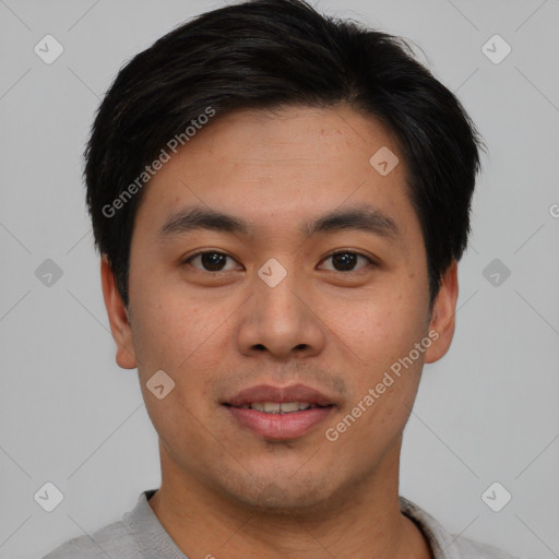 Joyful asian young-adult male with short  brown hair and brown eyes