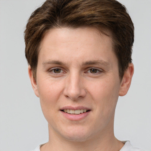 Joyful white young-adult female with short  brown hair and grey eyes