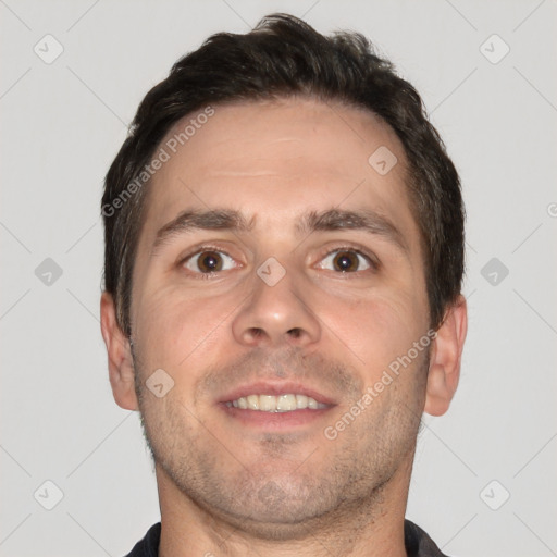 Joyful white adult male with short  brown hair and brown eyes