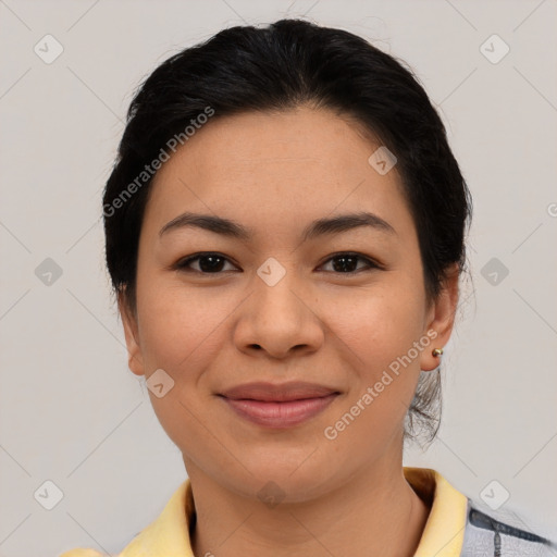 Joyful asian young-adult female with medium  black hair and brown eyes