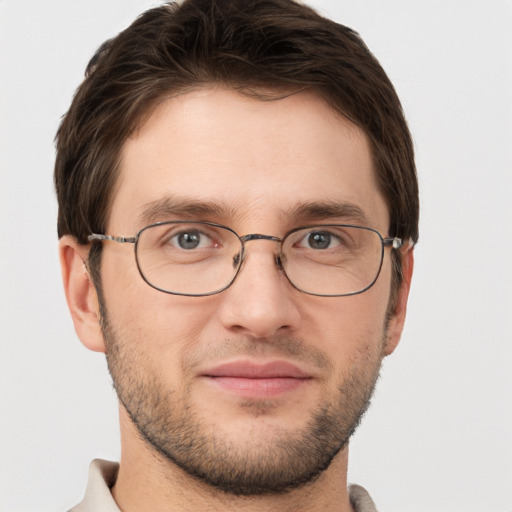 Joyful white adult male with short  brown hair and grey eyes