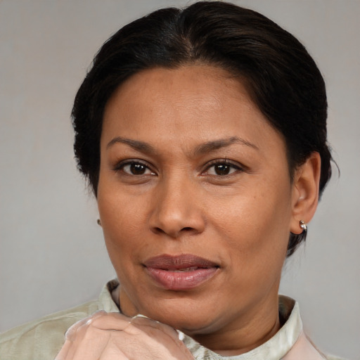 Joyful asian adult female with short  brown hair and brown eyes