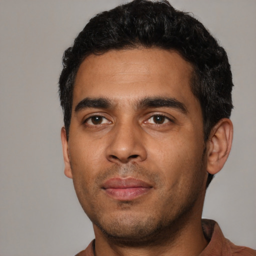Neutral latino young-adult male with short  black hair and brown eyes