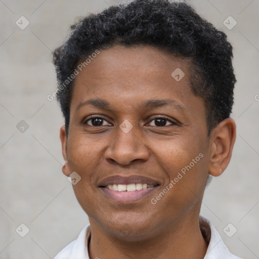 Joyful black young-adult male with short  brown hair and brown eyes