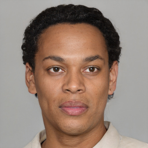 Neutral black young-adult male with short  black hair and brown eyes