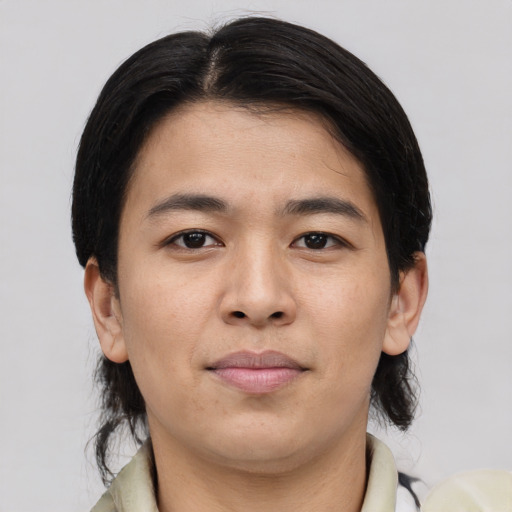 Joyful asian young-adult male with medium  brown hair and brown eyes