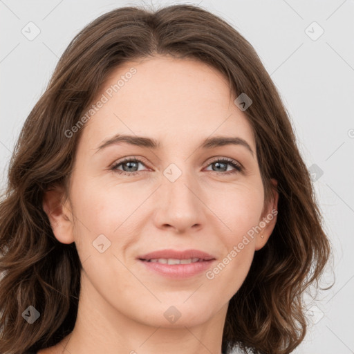 Joyful white young-adult female with medium  brown hair and green eyes