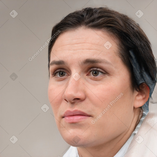 Joyful white adult female with short  brown hair and brown eyes