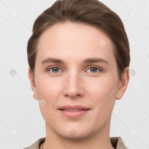 Joyful white young-adult female with short  brown hair and grey eyes