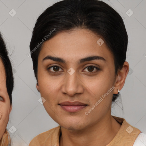 Joyful latino young-adult female with medium  brown hair and brown eyes