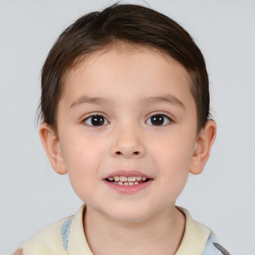 Joyful white child male with short  brown hair and brown eyes