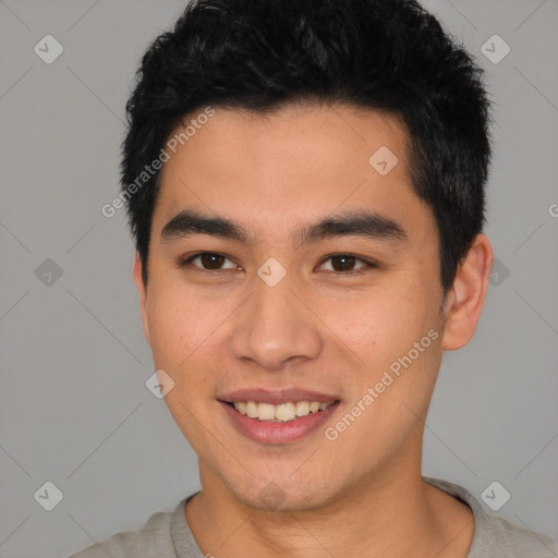 Joyful asian young-adult male with short  black hair and brown eyes