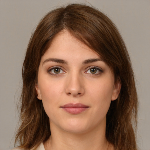 Neutral white young-adult female with medium  brown hair and green eyes