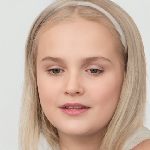 Joyful white child female with long  brown hair and brown eyes