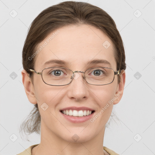 Joyful white young-adult female with short  brown hair and grey eyes