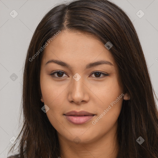 Joyful latino young-adult female with long  brown hair and brown eyes