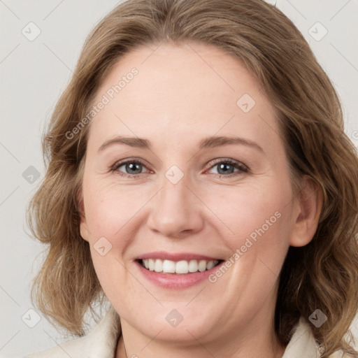 Joyful white young-adult female with medium  brown hair and blue eyes