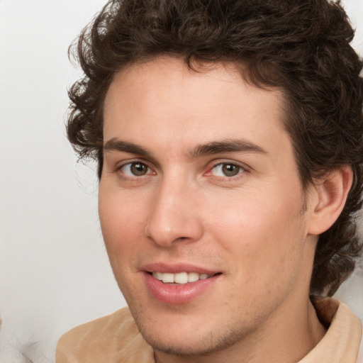 Joyful white young-adult male with medium  brown hair and brown eyes