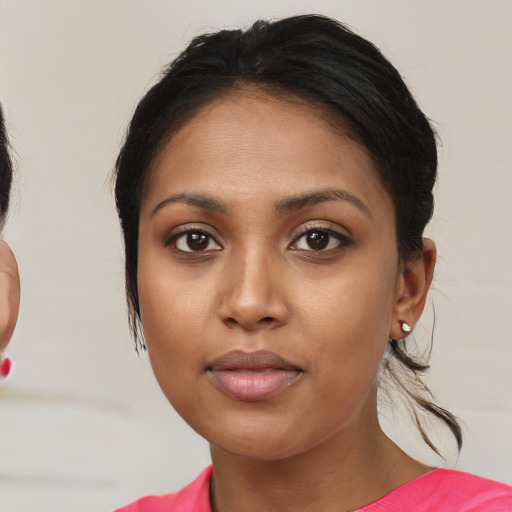 Neutral asian young-adult female with medium  brown hair and brown eyes