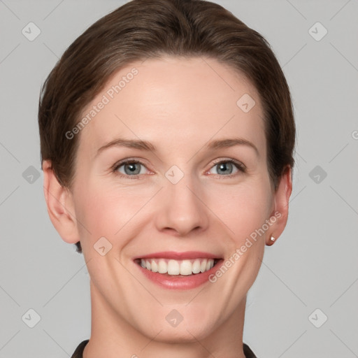 Joyful white young-adult female with short  brown hair and grey eyes