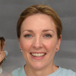 Joyful white adult female with short  brown hair and grey eyes