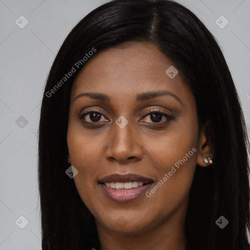 Joyful latino young-adult female with long  black hair and brown eyes