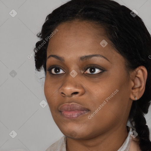 Joyful black young-adult female with medium  black hair and brown eyes