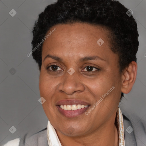 Joyful latino adult female with short  brown hair and brown eyes