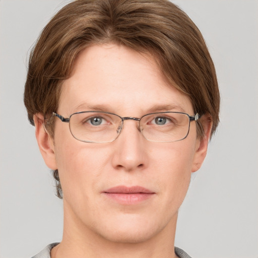 Joyful white adult male with short  brown hair and grey eyes