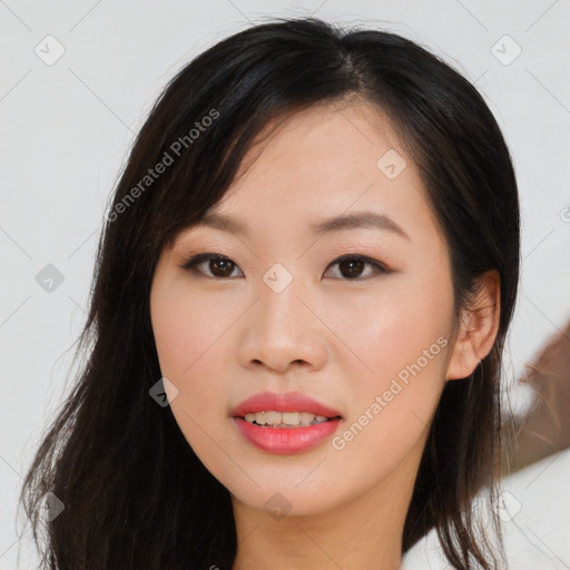 Joyful asian young-adult female with long  brown hair and brown eyes