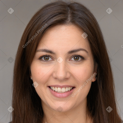 Joyful white young-adult female with long  brown hair and brown eyes