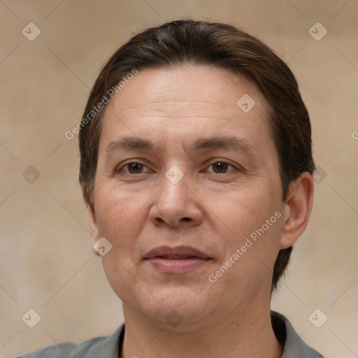 Joyful white adult female with short  brown hair and brown eyes