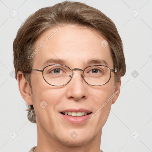 Joyful white adult male with short  brown hair and grey eyes