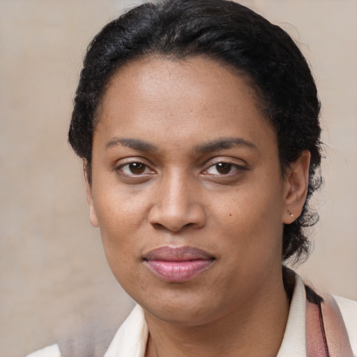 Joyful latino adult female with short  black hair and brown eyes