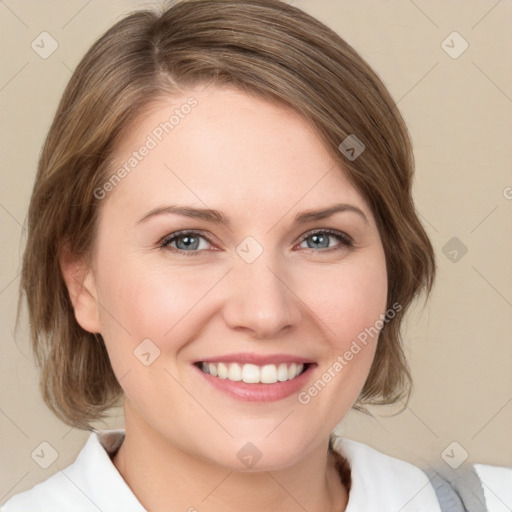 Joyful white young-adult female with medium  brown hair and green eyes